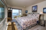 Master Bedroom features a queen bed and bayviews
